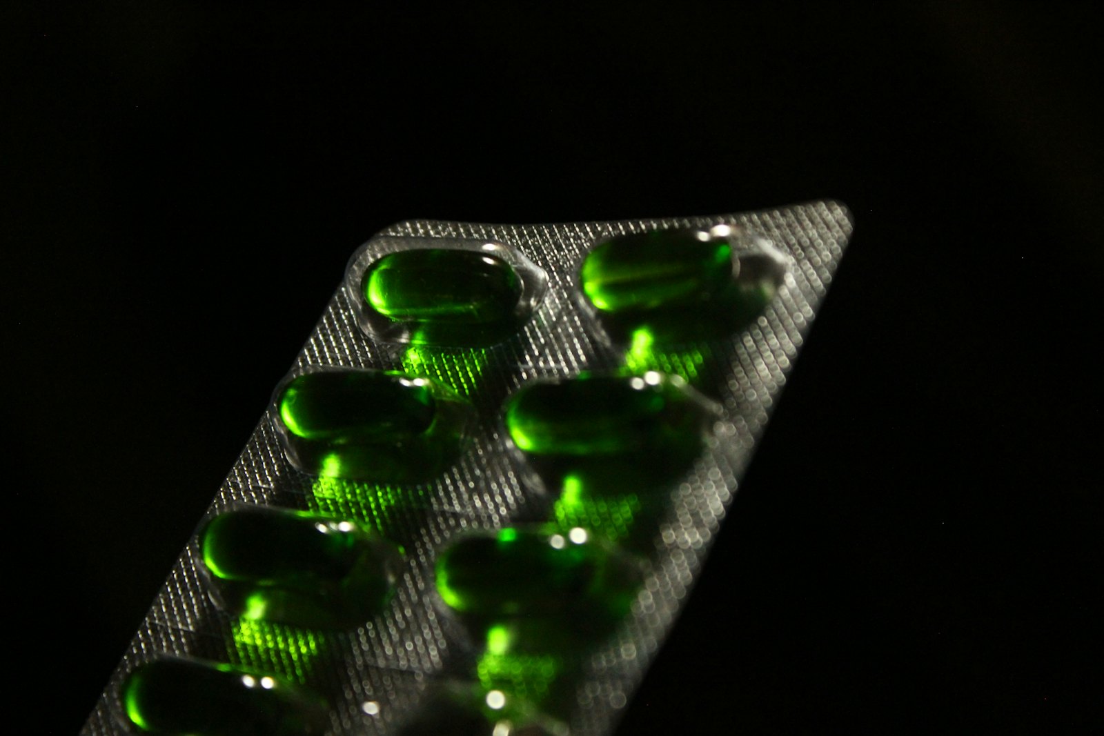A single tablet in a blister pack, close up.